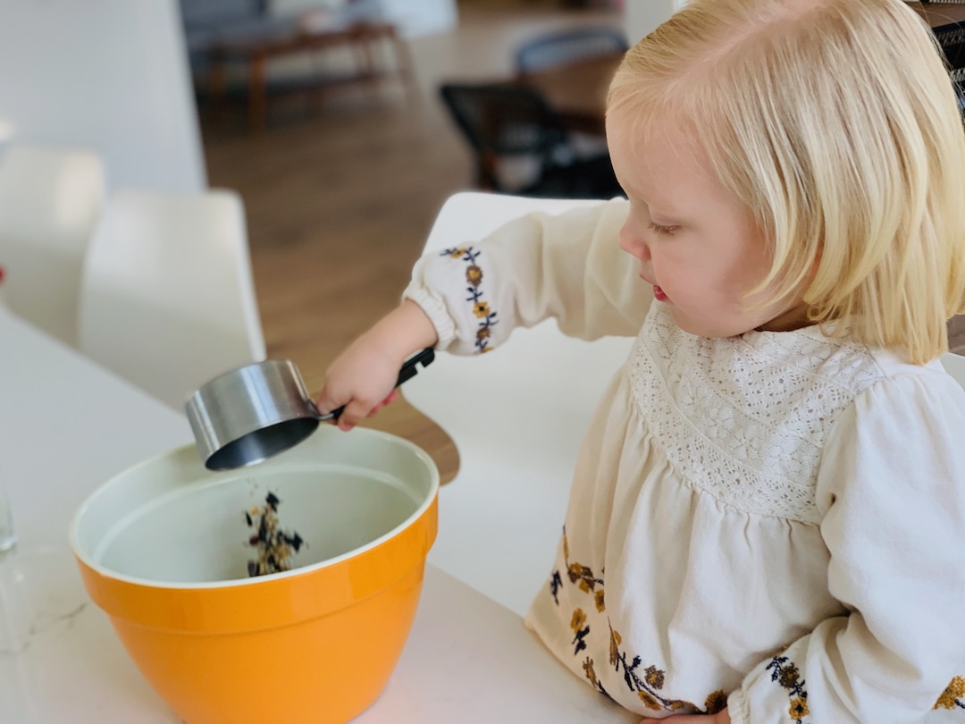 adding birdseed to birdseed cookies