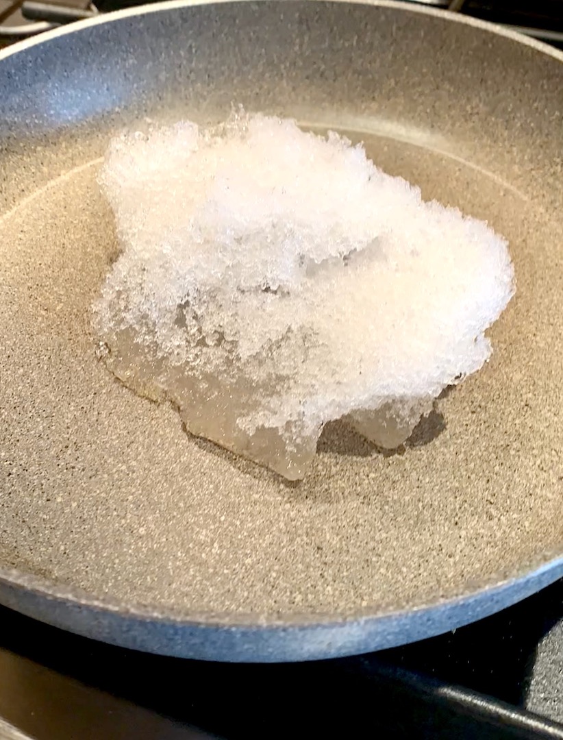 pan of snow melting on the stove