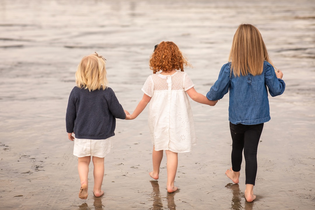 granddaughters playing at the beach