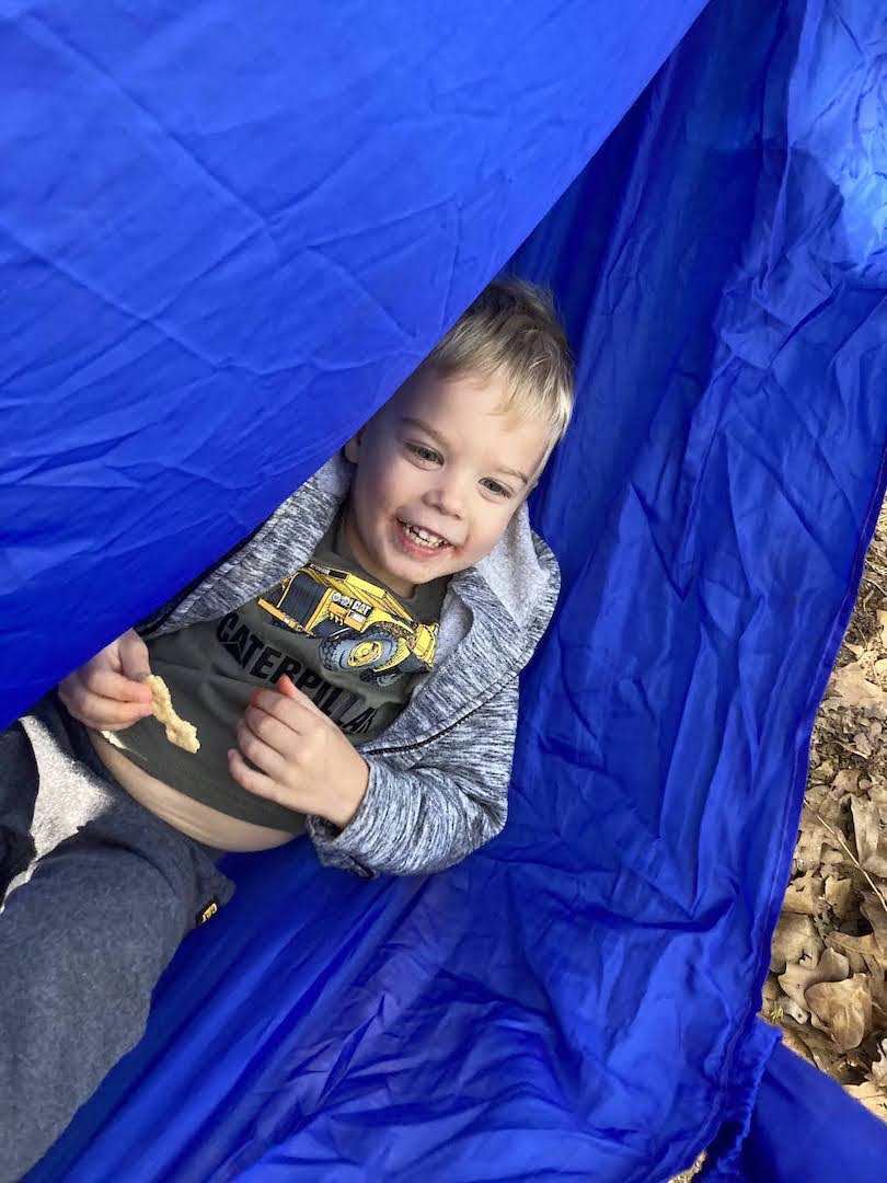 child playing in tent