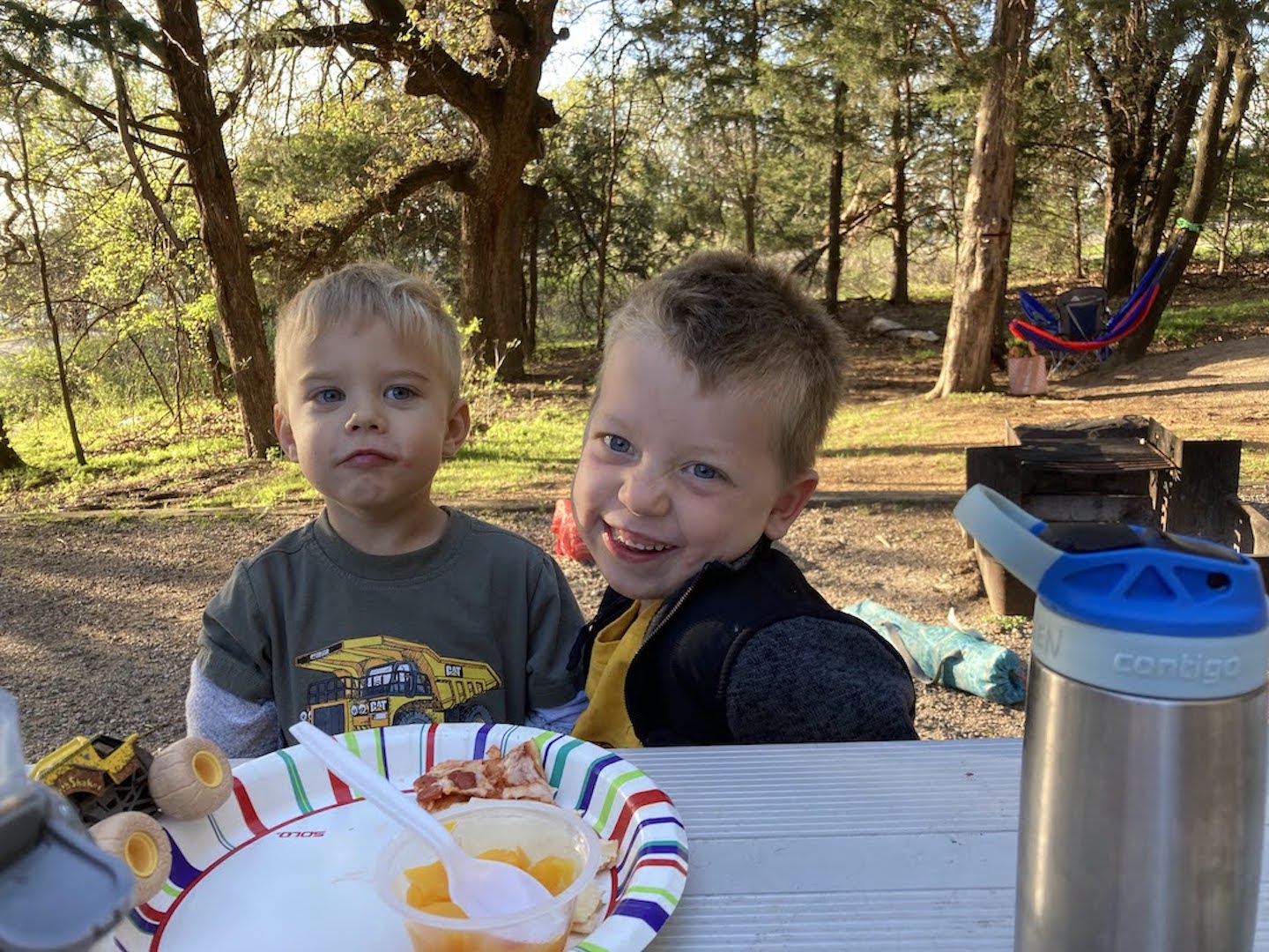 eating pizza at the campsite